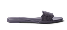 Load image into Gallery viewer, A single dark purple flat slide sandal with a textured floral lace-up strap, shown in profile against a white background.