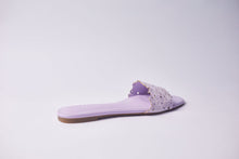 Load image into Gallery viewer, A single lavender purple slide sandal with a textured, perforated strap and a flat sole, shown from a side profile on a light gray background.